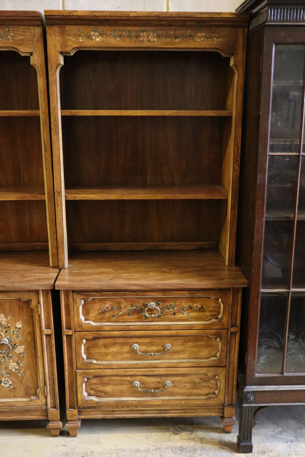 Three American stencilled walnut cabinets, total width 270cm, depth 44cm, height 181cm